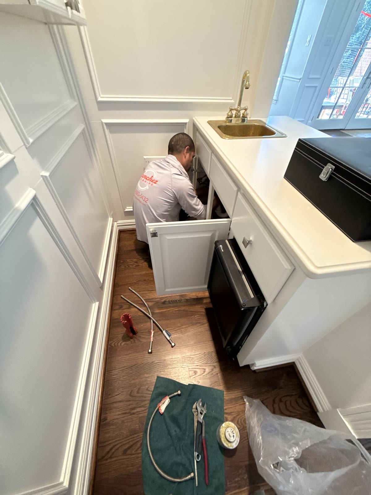 A Sanchez Plumbing technician at work